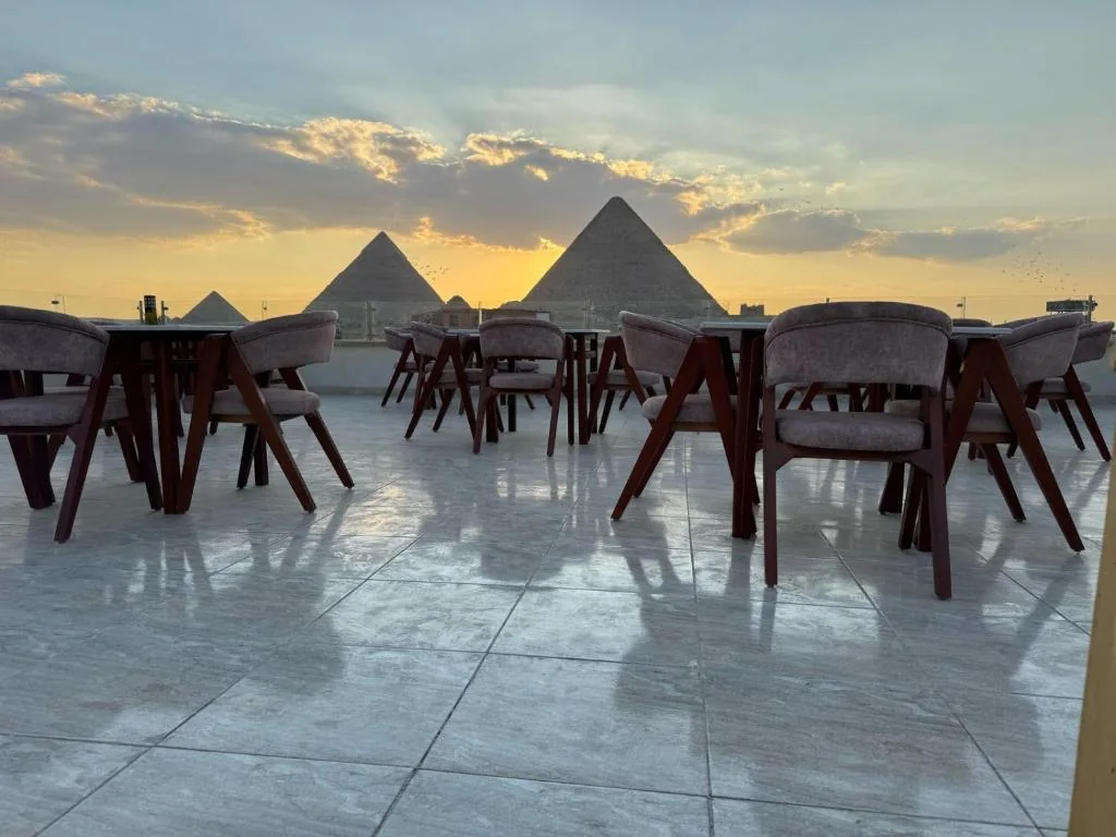 Rooftop sunset view of the Giza Pyramids at Dyafa Pyramids Hotel and Spa