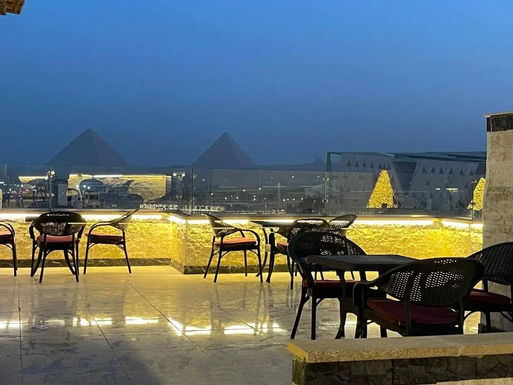 Jewel rooftop at night with views of the pyramids and Grand Egyptian Museum