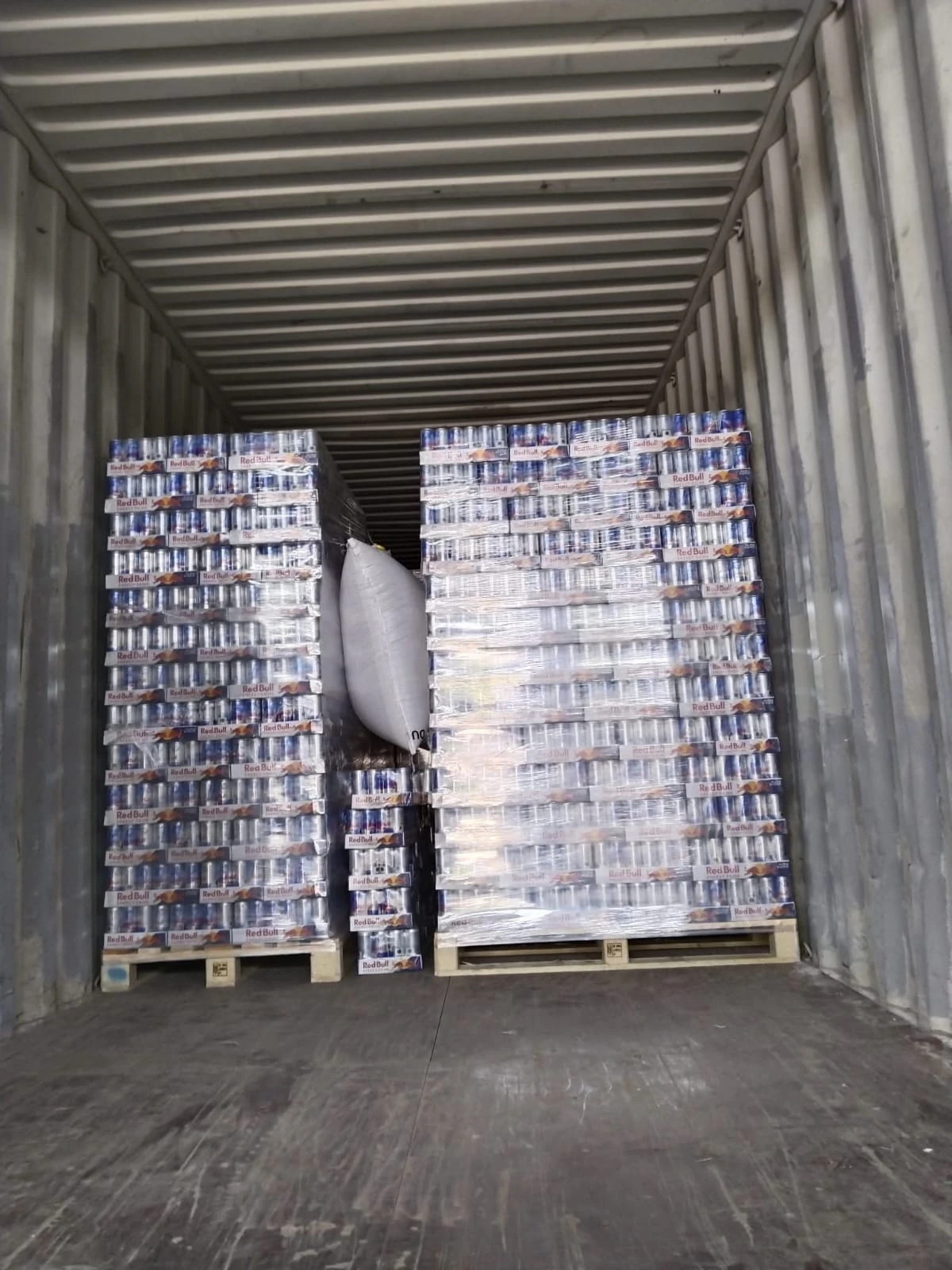 Red Bull pallets loaded inside export container
